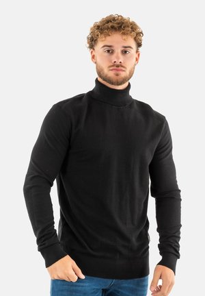 Maglione a collo alto nero in un morbido tessuto a maglia con accenti a costine sulle spalle e sulle maniche; design aderente con maniche lunghe.
