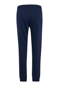 Granatowe spodnie dresowe z elastycznym paskiem w talii, zwężanymi nogawkami i prążkowanymi mankietami. Wykonane z miękkiej bawełnianej tkaniny, charakteryzują się gładką fakturą.