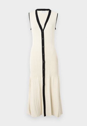 Kreemivärvi kudumkleit musta nööbirea ja kraega. Äratuseta disain, soonikkoe ja flared alläär, kus on peened mustrid.