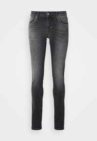 Uske tanke traperice u tamnosivoj denim boji, sa klasičnim dizajnom pet džepova, zatvaračem i kopčanjem na dugme, te minimalnim izbljeđivanjem za elegantan izgled.