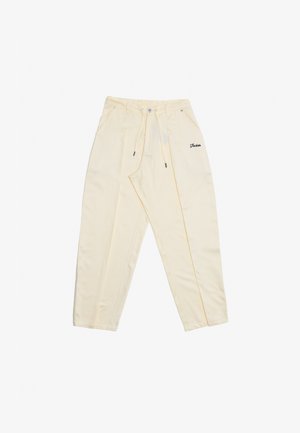 Hellgelbe Hose mit lockerer Passform, ausgestattet mit einem Kordelzugbund, zwei seitlichen Taschen und gesticktem Branding auf der Vorderseite.