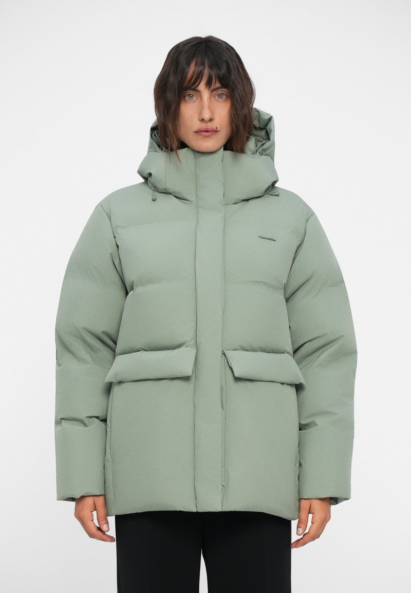 Padded hooded jacket in light green, featuring two front pockets, a zip closure, and a smooth, matte texture.