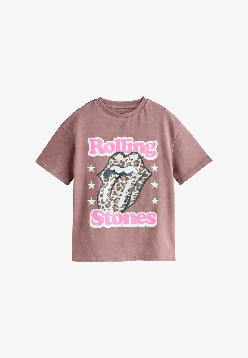 T-shirt marron oversize avec texte rose « Rolling Stones » et logo de langue léopard entouré d'étoiles blanches.