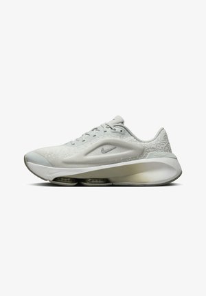 Light grey athletic shoe with a textured mesh upper, smooth toe cap, and cushioned sole featuring visible air pockets. Nike logo present.