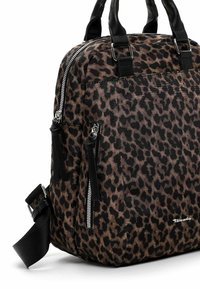 Leopard print handbag made of fabric, featuring black accents, two zippered pockets, and dual top handles with an adjustable strap.
