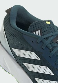 Adidas Adizero SL running shoe featuring a dark teal mesh upper, white perforated stripes, and a light gray sole with green accents.