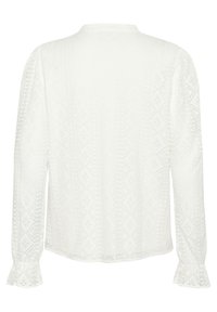 White long-sleeve blouse with a textured diamond pattern. Features ruffled sleeves and a round neckline, made from lightweight fabric.