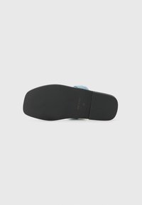 Blue fabric sandal with a smooth black rubber sole, featuring a slight heel and ribbed texture for added grip. Size 37, made in Italy.