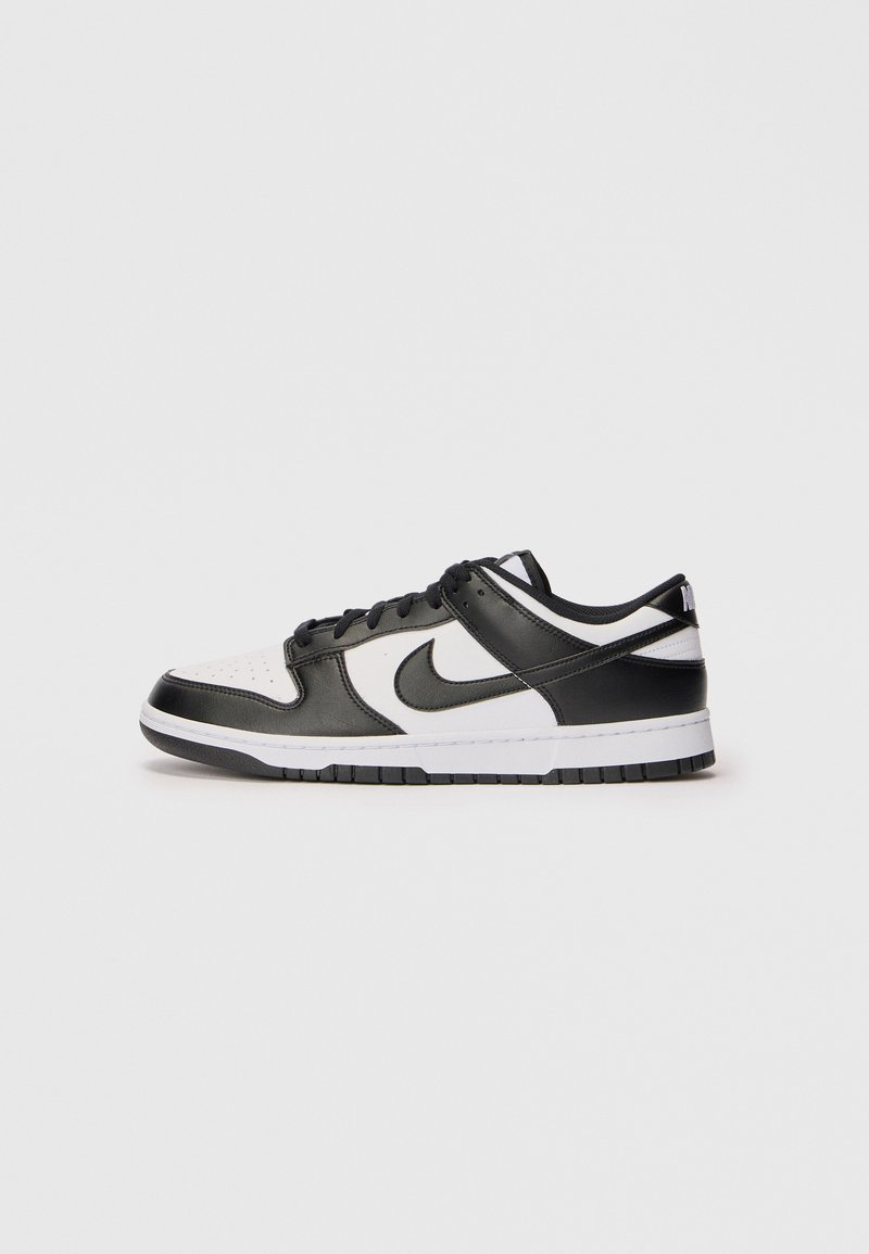 Nike Dunk sneakers ar melnu ādas augšdaļu, baltu perforētu purngali un melnu gumijas zoli. Vienkāršs dizains ar kontrastējošiem krāsu akcentiem.