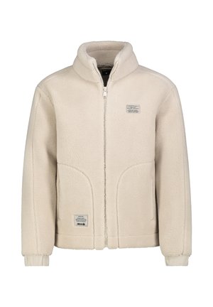 Beige Fleecejacke mit Reißverschluss, hohem Kragen, langen Ärmeln, zwei Fronttaschen und kleinen rechteckigen Aufnähern auf Brust und Taille.