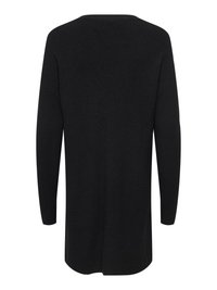 Pull noir à manches longues avec une texture côtelée, un col arrondi et des fentes sur les côtés pour faciliter les mouvements. Tissu à finition lisse.