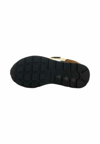 Suola di scarpa in gomma nera con un motivo di tessitura e battistrada. Presenta un marchio discreto e un design a contrasto marrone e giallo sul bordo superiore.