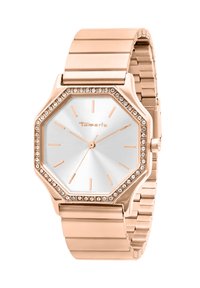 Roségoldenes achteckiges Uhr mit einem silbernen Zifferblatt, minimalistischen Stundenmarkierungen und einer mit Kristallen besetzten Lünette. Metallarmband mit polierter Oberfläche.