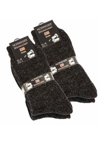 Calze di lana nere con una texture a costine e macchie grigie a contrasto. Ogni paio ha un'etichetta che indica la taglia 43-46 e il marchio "Norweger."