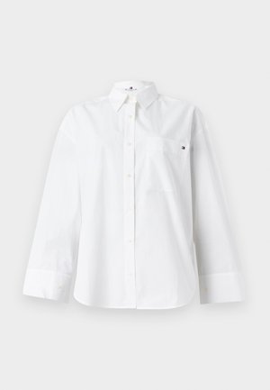 Bijela košulja dugih rukava od pamuka s kragnom na gumbe, džepom na prsima i malim logotipom na džepu.