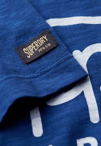 Superdry & Co SCRIPT niebieski