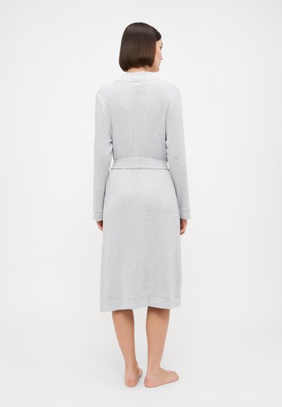 Light grey long bathrobe made of soft fabric, featuring a collar, long sleeves, and a tied waist with a ribbed texture at the back.