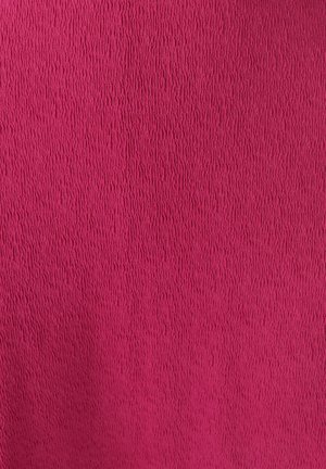 Textured fabric in bright pink, featuring a subtle, raised pattern with vertical lines, providing a tactile feel and visual interest.