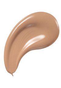Échantillon de fond de teint beige crémeux avec une texture lisse et brillante, présentant une forme arrondie et une répartition de couleur subtile et homogène.