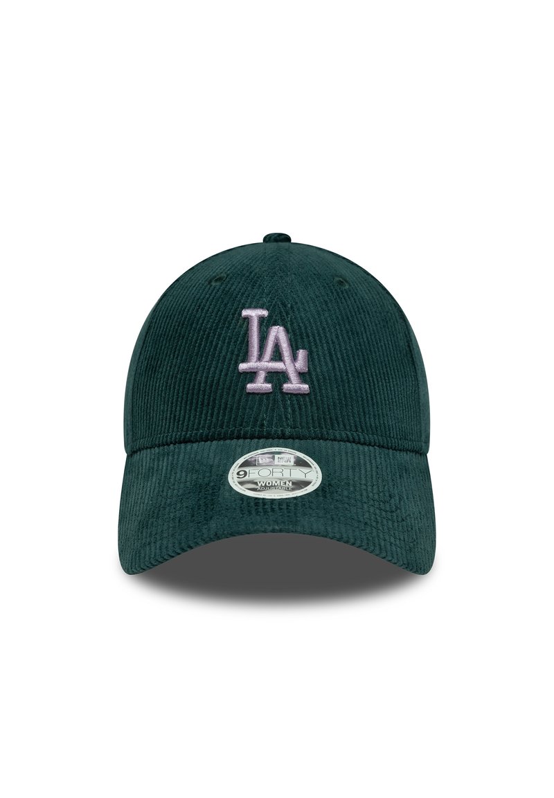 Dark green corduroy baseball cap with stitched "LA" logo in light pink, curved brim, and adjustable strap at the back.