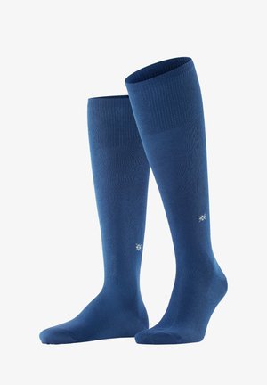 Kniestrümpfe in einfarbigem Marineblau, mit einem gerippten oberen Bund und glatter Textur. Beinhaltet ein kleines weißes Logo an der Seite.