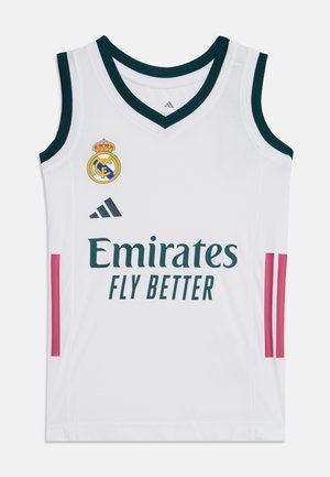 Biała bezrękawnikowa koszulka do koszykówki Real Madrid z czarną lamówką, logo Emirates Fly Better, logo Adidas oraz herbem drużyny na piersi.
