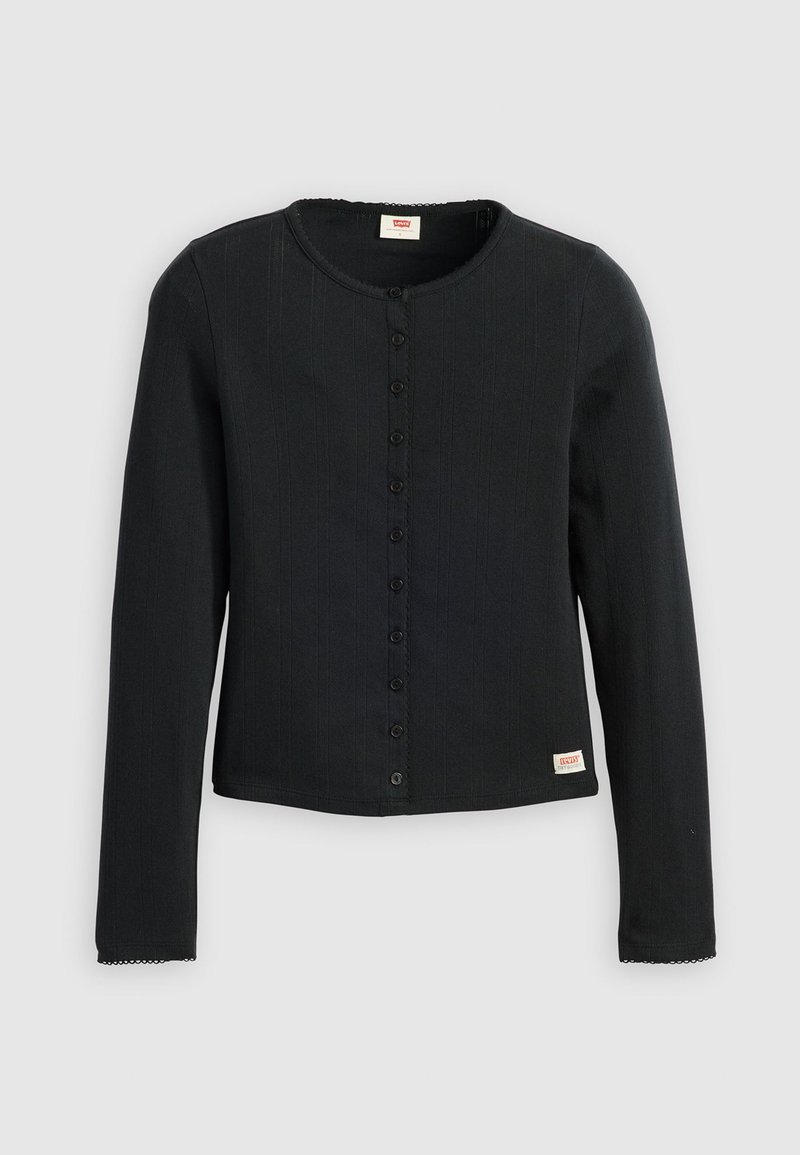 Chemise noire à manches longues avec un col rond, fermeture à boutons sur le devant, texture nervurée et bords de manches en forme de vagues. Étiquette de la marque en bas à gauche.