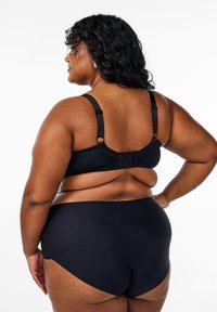Black lingerie set featuring a bralette with adjustable straps and hook-and-eye closure, paired with high-waisted bikini bottoms. Smooth texture.
