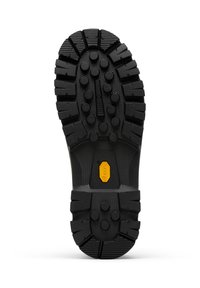 Kumipohja, jossa on syvät urat, jotka ovat varustettu silmiinpistävillä pyöreillä ja suorakulmaisilla kuvioilla. Keltainen Vibram-logo sijoitettuna pohjan keskikohtaan.