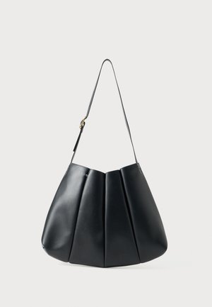 Black leather shoulder bag with pleated design, smooth texture, single strap, and a subtle gold hardware accent.