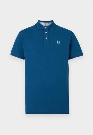 Polo shirt bleu marine en coton, avec un col à trois boutons, des manches courtes et une surface texturée arborant un logo discret.