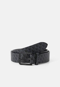 Black belt made of textured material, featuring a pattern and a smooth finish. Includes a sleek black metal buckle.