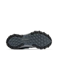 Columbia trail shoe outsole featuring a gray rubber base with prominent hexagonal lugs for traction. Black accents around the edges.