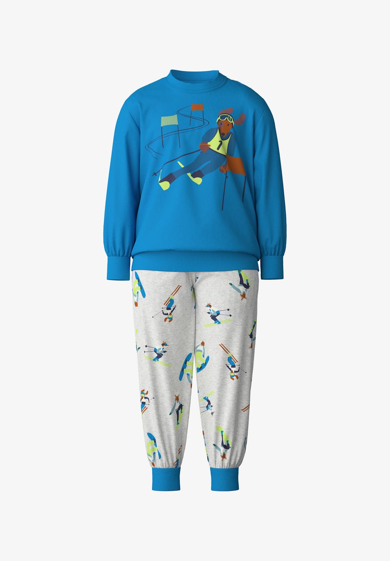 Blauwe sweatshirt met een afbeelding van een skiër en grijze broek met een skipatroon. Beide gemaakt van zachte stof, met ribgebreide boorden.