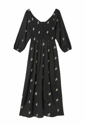 Black midi dress with long sleeves, smocked bodice, button details, and small scattered white floral print.