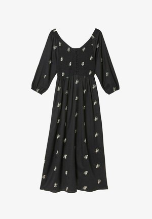 Black midi dress with long sleeves, smocked bodice, button details, and small scattered white floral print.