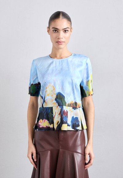 Short-sleeved blue blouse with a floral print in green, yellow, and orange. Features a pleated hem and a round neckline. Smooth texture.