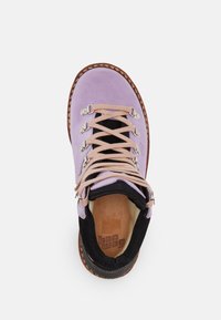 Purple suede hiking boot with black accents, beige laces, metal eyelets, and a tan insole featuring a brand logo.