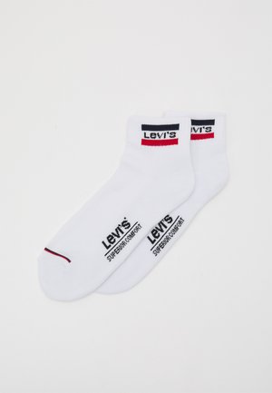 White cotton socks featuring black and red Levi's branding. Text reads "Levi's" and "Superior Comfort." Ankle length with a smooth texture.