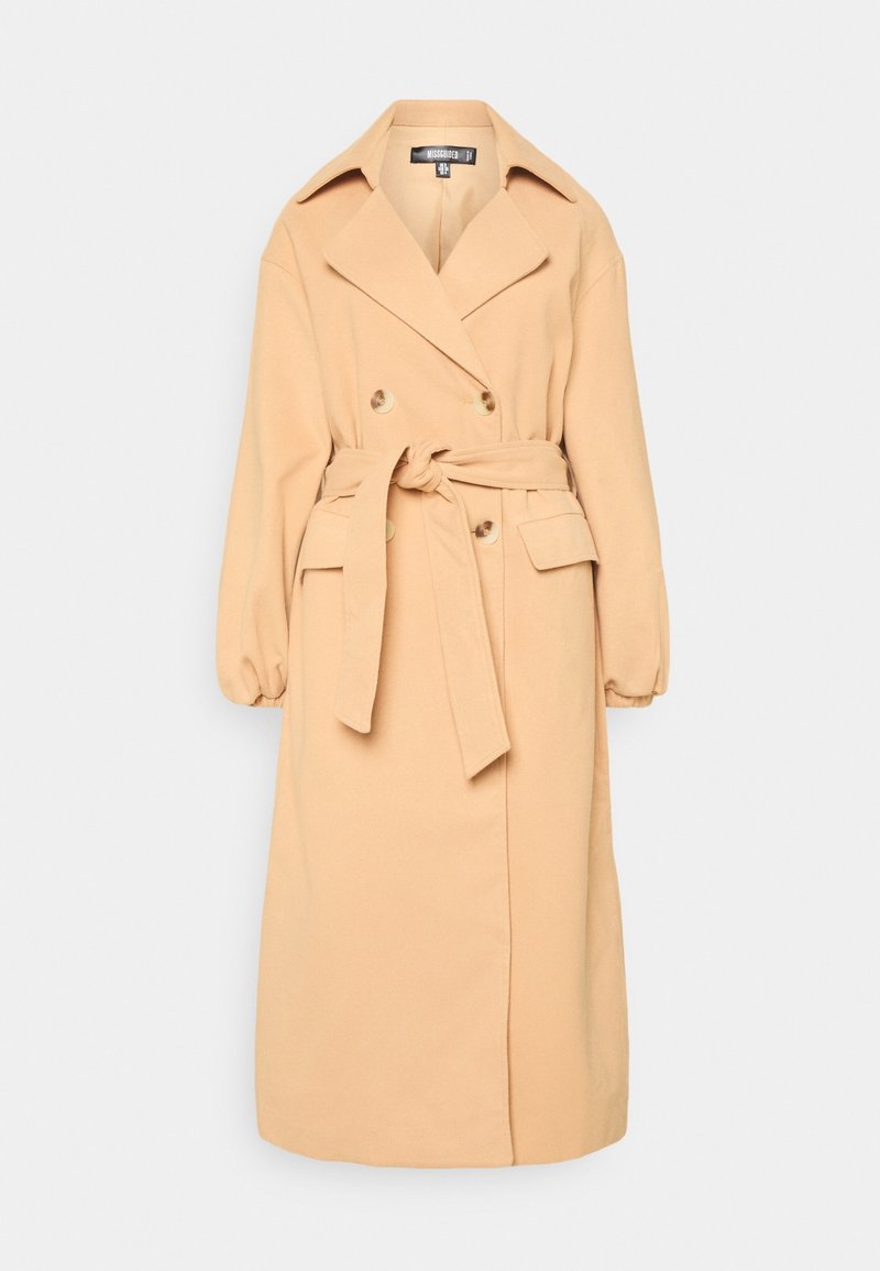 Beige ullblandning trench coat med dubbelknäppt fram, stor krage, knytbälte och sidofickor. Har långa, pösiga ärmar.