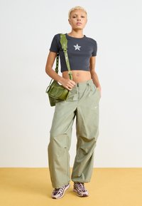 Nike Sportswear REPEL PANT - Trousers - light army/white