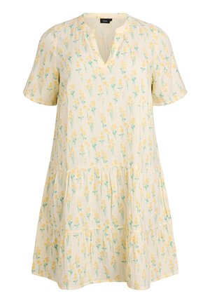 Kermanvärinen lyhythihainen mekko, jossa kerroksittainen hame ja keltainen kukkakuosi, V-pääntiellä.