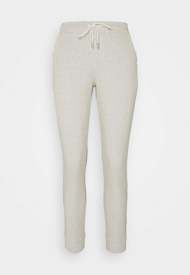 Joggers de punto en un tono beige claro con un sutil patrón de espiga, cinturilla elástica, cordón y tobillos ajustados.