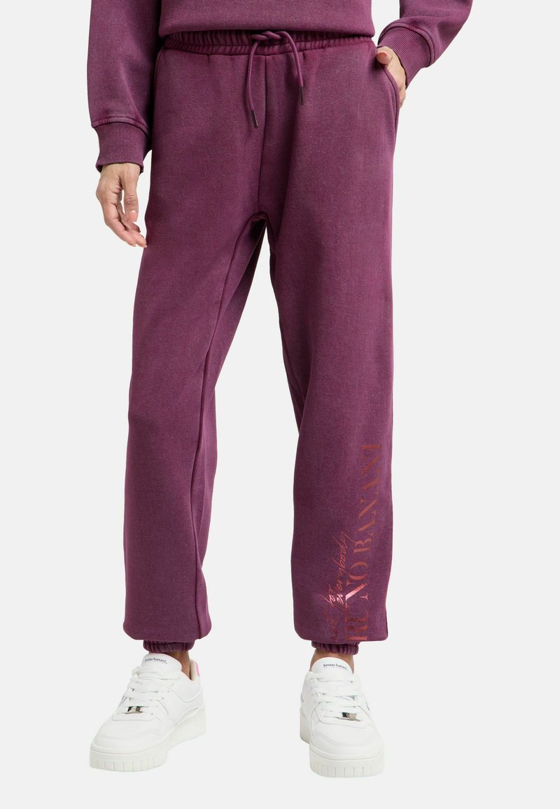 Bordeauxfarbene Jogginghose aus weichem, strukturiertem Stoff mit elastischem Bund und Bündchen; mit einem aufgedruckten Logo in kontrastierender Farbe.