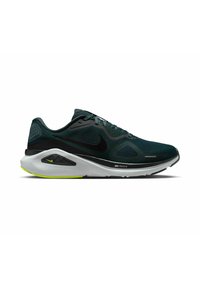 Zapatillas de running para hombre de Nike con una parte superior de malla verde oscuro, detalles en negro y una suela blanca con un brillante detalle amarillo en el talón.