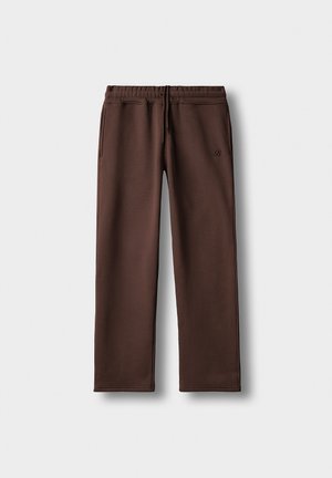 Braune Sweatpants aus weichem Stoff; mit elastischem Bund, Kordelzug und Seitentaschen; dezentes Logo am linken Bein.