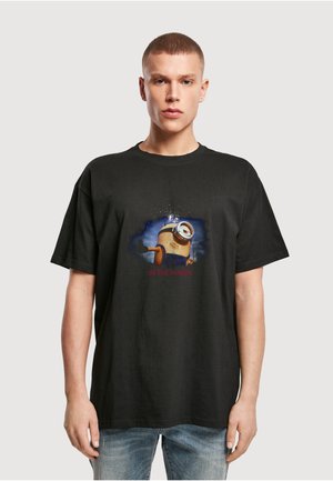 Sort bomuld T-shirt med print af en Minion og teksten "IN THE MAKIN'" nedenunder, korte ærmer og en afslappet pasform.