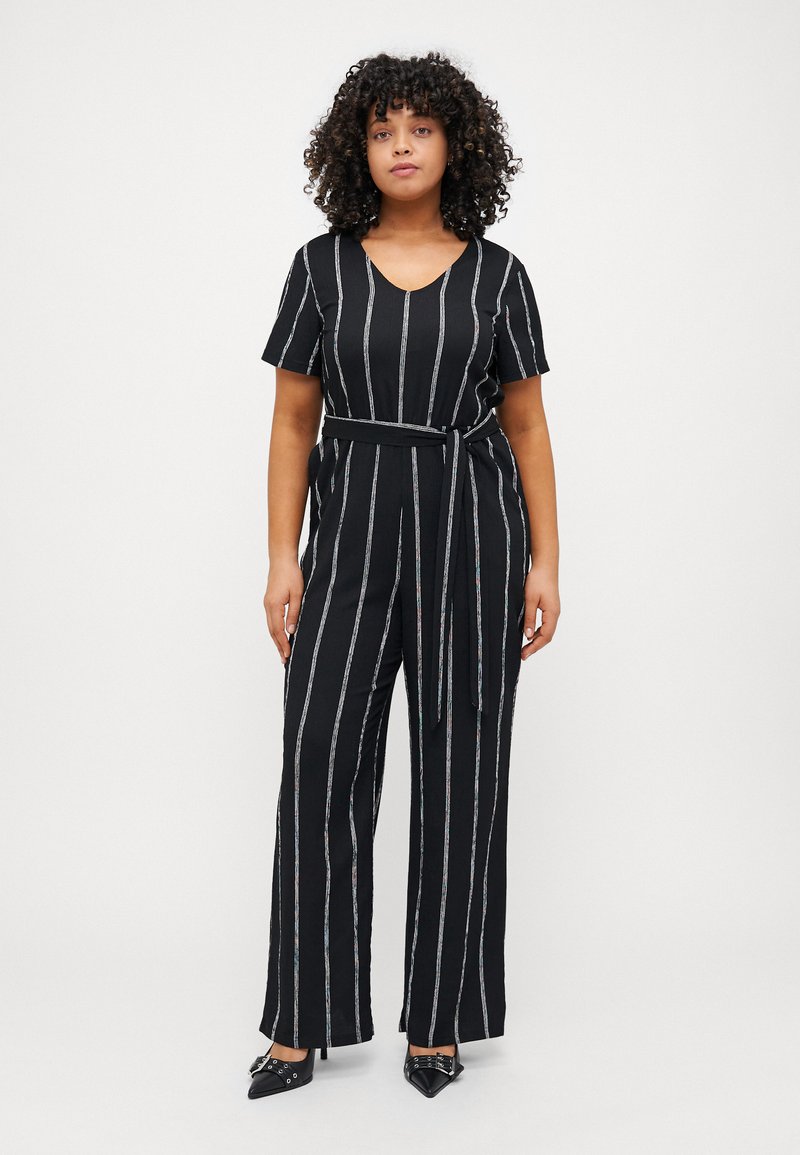 Black striped jumpsuit with a V-neck, short sleeves, a tie belt at the waist, and wide-leg silhouette. Features multi-colored vertical stripes.