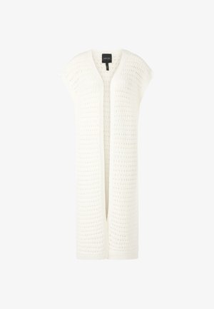 White knitted cardigan with a loose fit, open front, and cap sleeves. Features a textured pattern throughout and a ribbed hem.