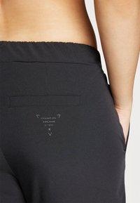 Champion C-TECH WIDE LEG PANTS - Pantalon classique - black